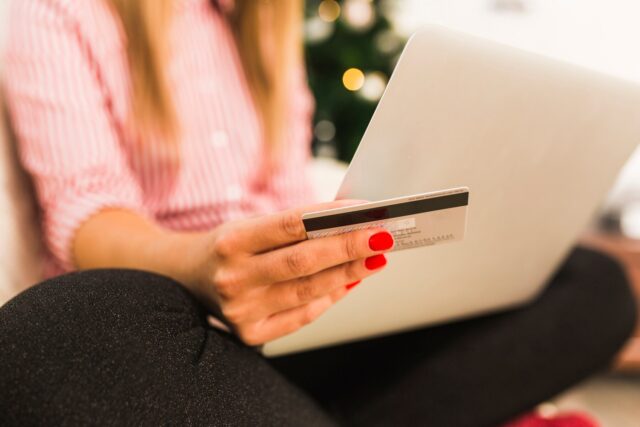 woman holding a credit card